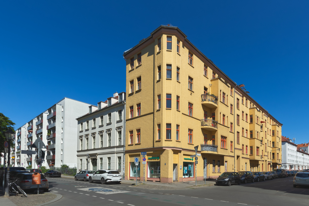 Perspective corrected digital renovation of a tall residential building with clean facade.