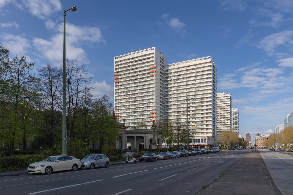 Photo of tall apartment buildings in a modernist architecture style near Spittelmarkt, Berlin during late summer.