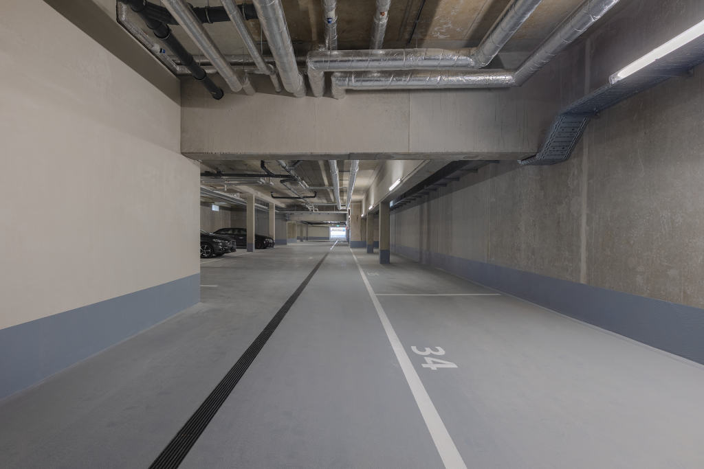 Interior photo of an underground parking structure.