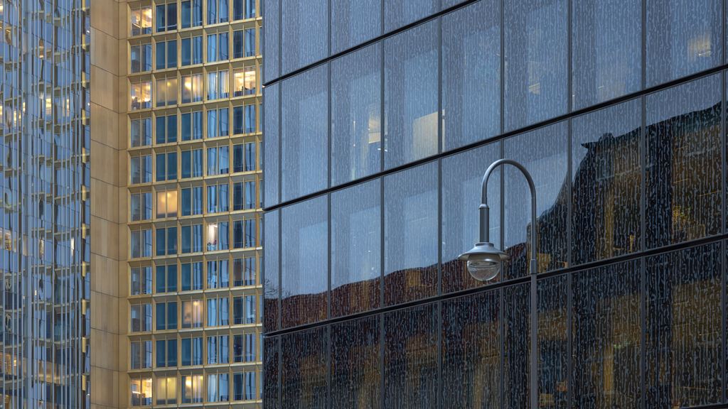 Facade detail of Axel Springer Neubau contrasted with the backdrop of the Axel Springer Tower.