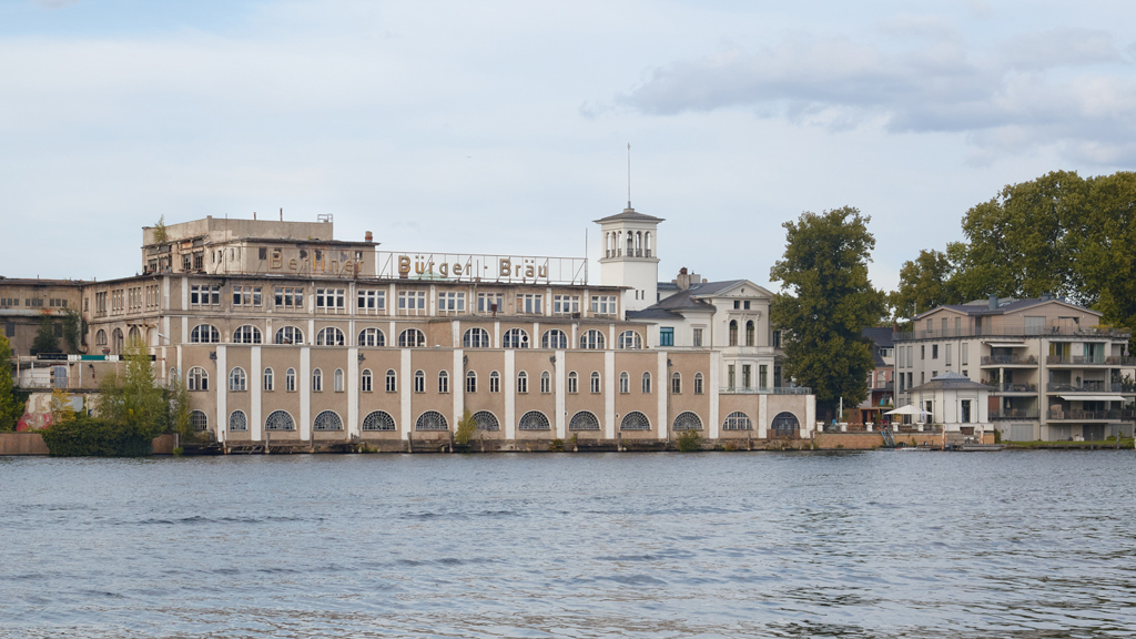Riverside view across the Müggelspree of the historic Berliner Bürgerbräu brewery, closed in 2010.