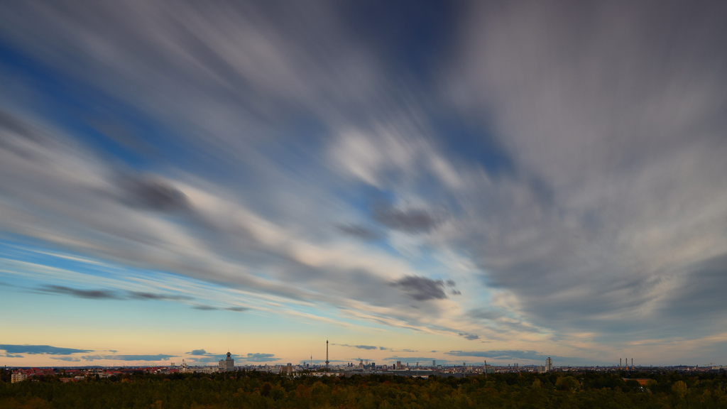 Atmospheric long exposure showing swift cloud movement above Berlin from the vantage point of Drachenberg.