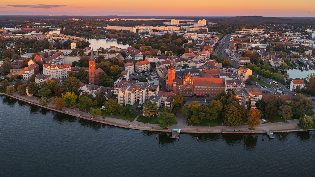 Wide aerial shot of Köpenickinsel at sunset, showcasing the island and its scenic surroundings.