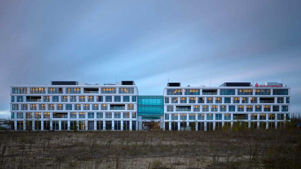Evening long exposure showcasing the Berliner Sparkasse Office Campus by Tchoban Voss Architekten in Johannisthal, Berlin.